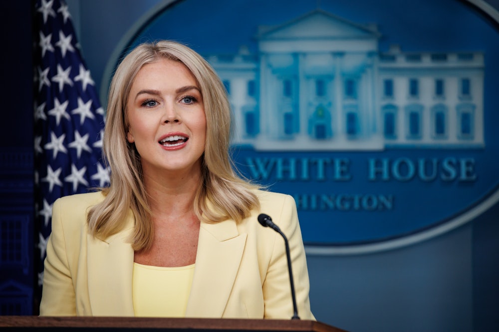 Karoline Leavitt speaks at the podium in the White House Press Briefing Room.